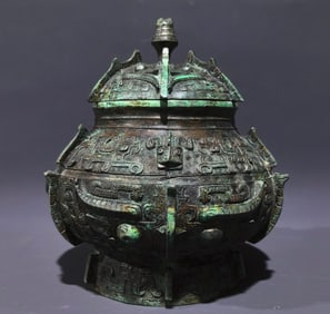 An Archaic Bronze Taotie Pattern Cover Jar