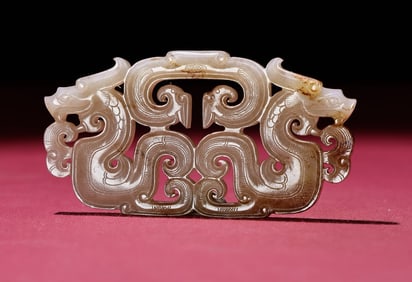 An Exquisite White Jade Dragon Pendant