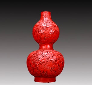 A Fine Carved Red Lacquer Gourd-Shaped Vase