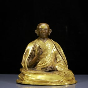 A Solemn Gilt Bronze Statue of Guru
