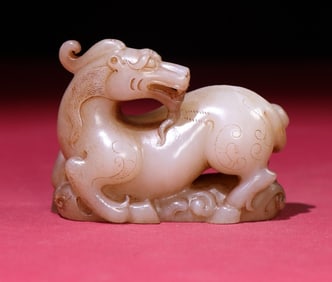 An Exquisite White Jade Auspicious Beast Hand Piece
