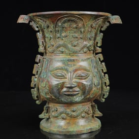 An Archaic Bronze Figure-Face Pattern Four Ears Vase