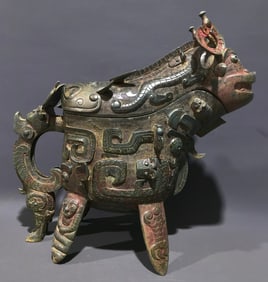 An Archaic Bronze Beast-Face Pattern Four Legs Beast-Shaped Cup