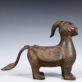 A Rare Bronze Human-Face Beast Ornament