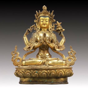 A Solemn Gilt Bronze Statue of Four-Armed Guanyin