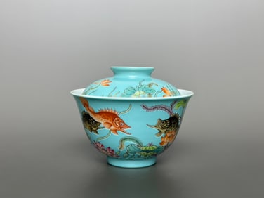 An Exquisite Famille-Rose Green Ground Fish and Lotus Pattern Bowl