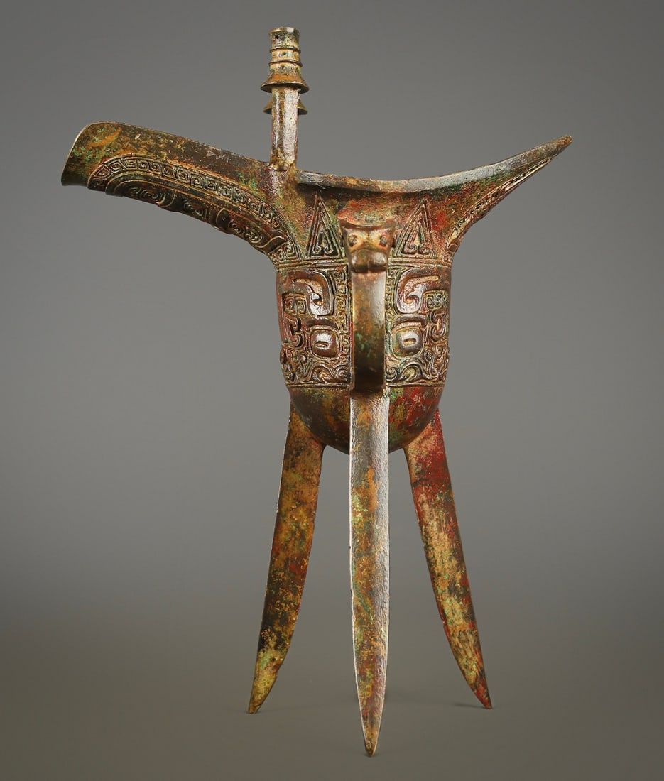 An Exquisite Bronze Beast-Face Pattern Goblet: An Exquisite Bronze Beast-Face Pattern Goblet W.Zhou , China Size:7.3inx3.9inx9.8in Weight:950g青铜兽面爵杯 西周时期 Size:18.5cmx10cmx25cm W