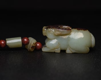 An Exquisite White Jade Buffalo Pendant