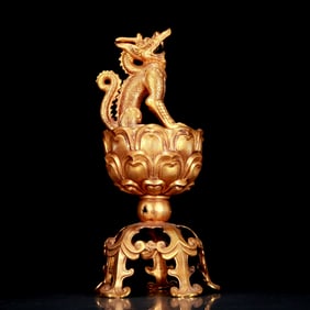 A stunning gilt bronze animal ornament