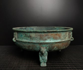 An Exquisite Bronze Beast-Face Pattern Tripod Basin