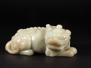 An Exquisite White Jade Lion Ornament