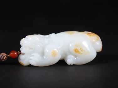An Exquisite White Jade Auspicious Beast Pendant