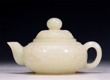 A Superb White Jade 'Scrolling Lotus' Teapot