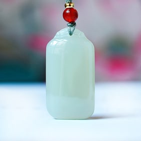 An Exquisite Greenish Jade Pendant