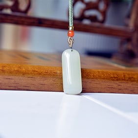 An Exquisite White Jade Pendant