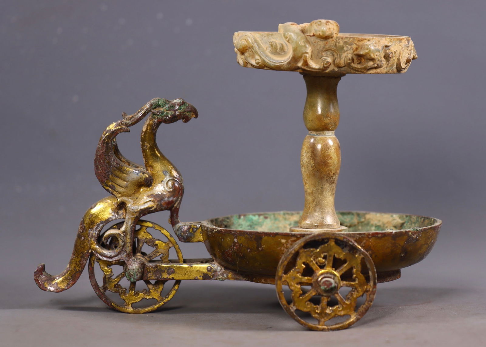 An Exquisite Gilt Bronze Inlaid White Jade Auspicious Beast-Shaped Candlestick: An Exquisite Gilt Bronze Inlaid White Jade Auspicious Beast-Shaped Candlestick Han Dynasty, China Size:5.7inx7.7inx5.3in Weight:934g青铜鎏金镶嵌白玉