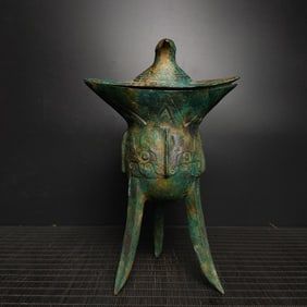 An Exquisite Bronze Bird Pattern Tripod Goblet