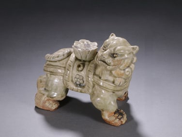 An Exquisite Celadon Lion Ornament