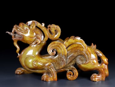 An Exquisite White Jade Auspicious Beast Ornament