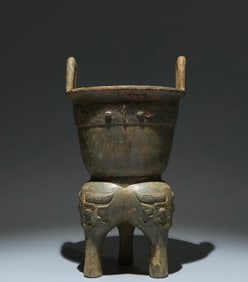 An Archaic Bronze Beast-Face Pattern Double-Ears and Tripod Food Vessel