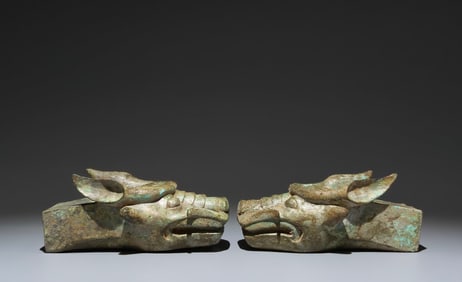 A Pair of Archaic Bronze Dragon-head Ornaments