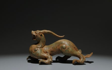 An Archaic Bronze Unicorn Ornament