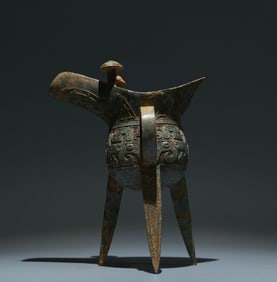 An Archaic Bronze Beast-Face Pattern Tripod Goblet