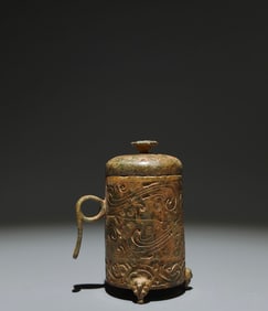 An Archaic Bronze Cloud Pattern Tripod Cover Jar