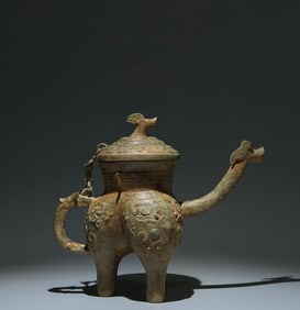 An Archaic Bronze Beast-Face Pattern Tripod Goblet