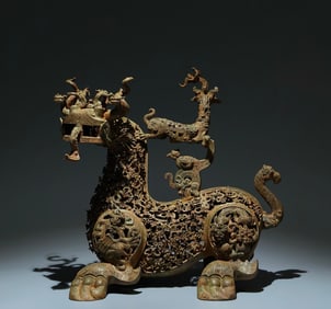 An Archaic Bronze Hollow Plum Blossom Pattern Auspicious Beast Ornament,With Inscription
