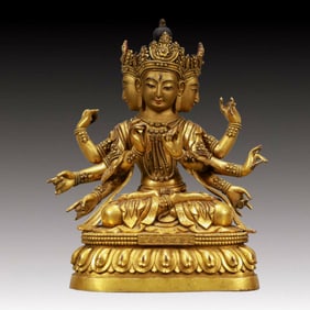 A Solemn Gilt Bronze Statue of Three-Headed and Eight-Armed Guanyin