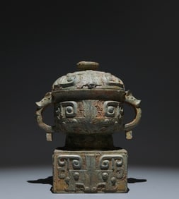 An Archaic Bronze Beast-Face Pattern Double-Ears and Tripod Food Vessel
