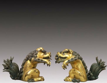 A Fabulous Pair Of Gilt-Bronze Lions