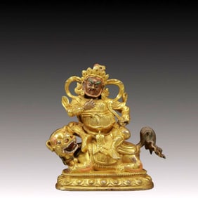 A Solemn Gilt Bronze Statue of Mammon Rides the Lion
