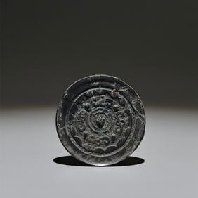 An Archaic Bronze Round Mirror
