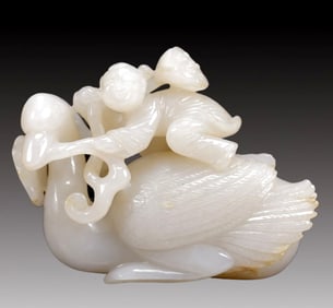 An Exquisite White Jade Figure Riding Goose Ornament