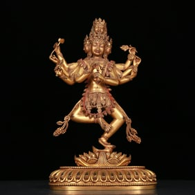 A stunning gilt bronze statue of Vajra