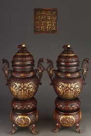 A pair of Gilt Red Copper Eight Treasures Pattern Elephant-Feet Censer
