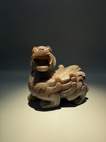 A Rare Gaogu Jade Auspicious Beast Ornament