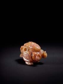 A Rare Hotan Jade Auspicious Beast-Shaped Handheld Ornament