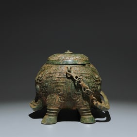 An Archaic Bronze Beast-Face Pattern Loop-handled Pot