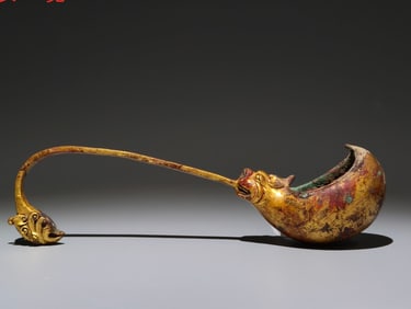 A Rare Gilt Bronze Beast Spoon