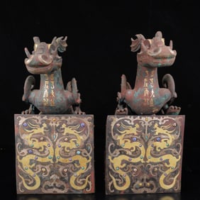 A Pair of Archaic Bronze Inlaid Gold and Silver Dragon Ornaments
