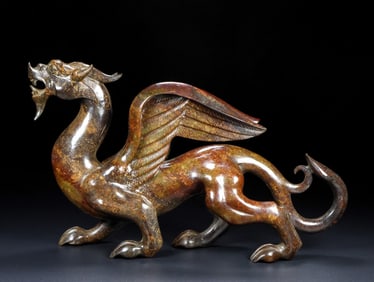 An Exquisite White Jade Auspicious Beast Ornament