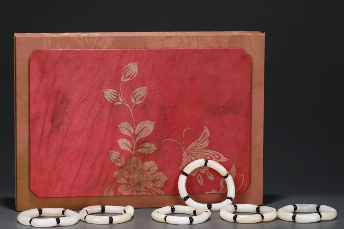 A Set of Rare White Jade Bracelets (1 of 8)