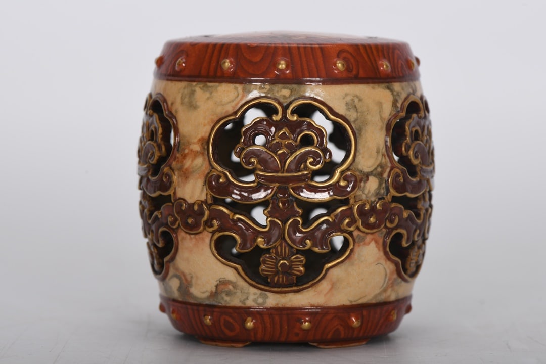 A Rare Wood Grain Glaze Hollow-Out Gold-Outlined Stone Pattern Drum Stool: A Rare Wood Grain Glaze Hollow-Out Gold-Outlined Stone Pattern Drum Stool,Qing Dynasty, China,Qianlong Four-Character Mark,Size:2.7inx2.3in 镂空描金石纹鼓