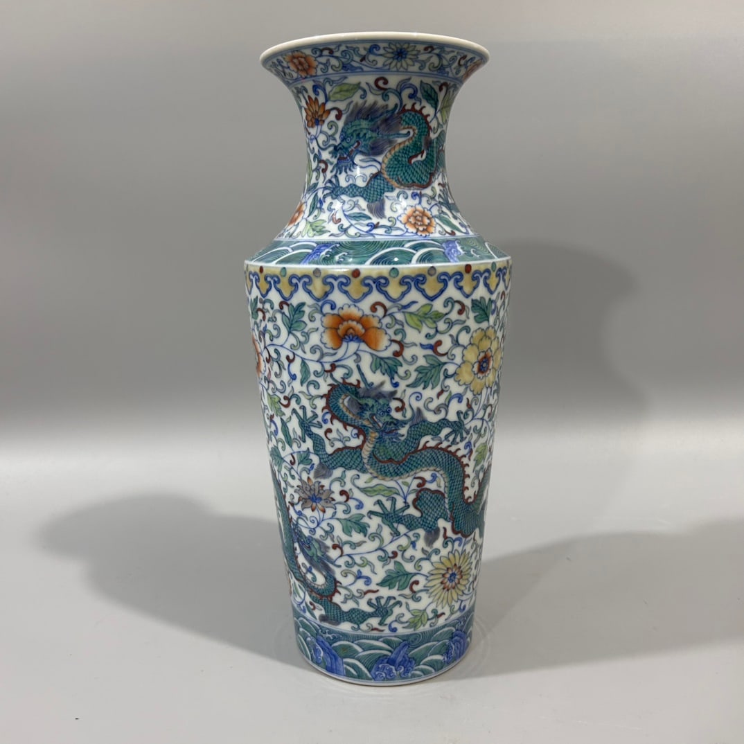 A Exquisite Doucai Lotus Dragon Pattern Vase: A Exquisite Doucai Lotus Dragon Pattern Vase,Qing Dynasty, China,Yongzheng Six-character Mark,Size:4.3inx10.8in 斗彩缠枝莲龙纹瓶,中国清
