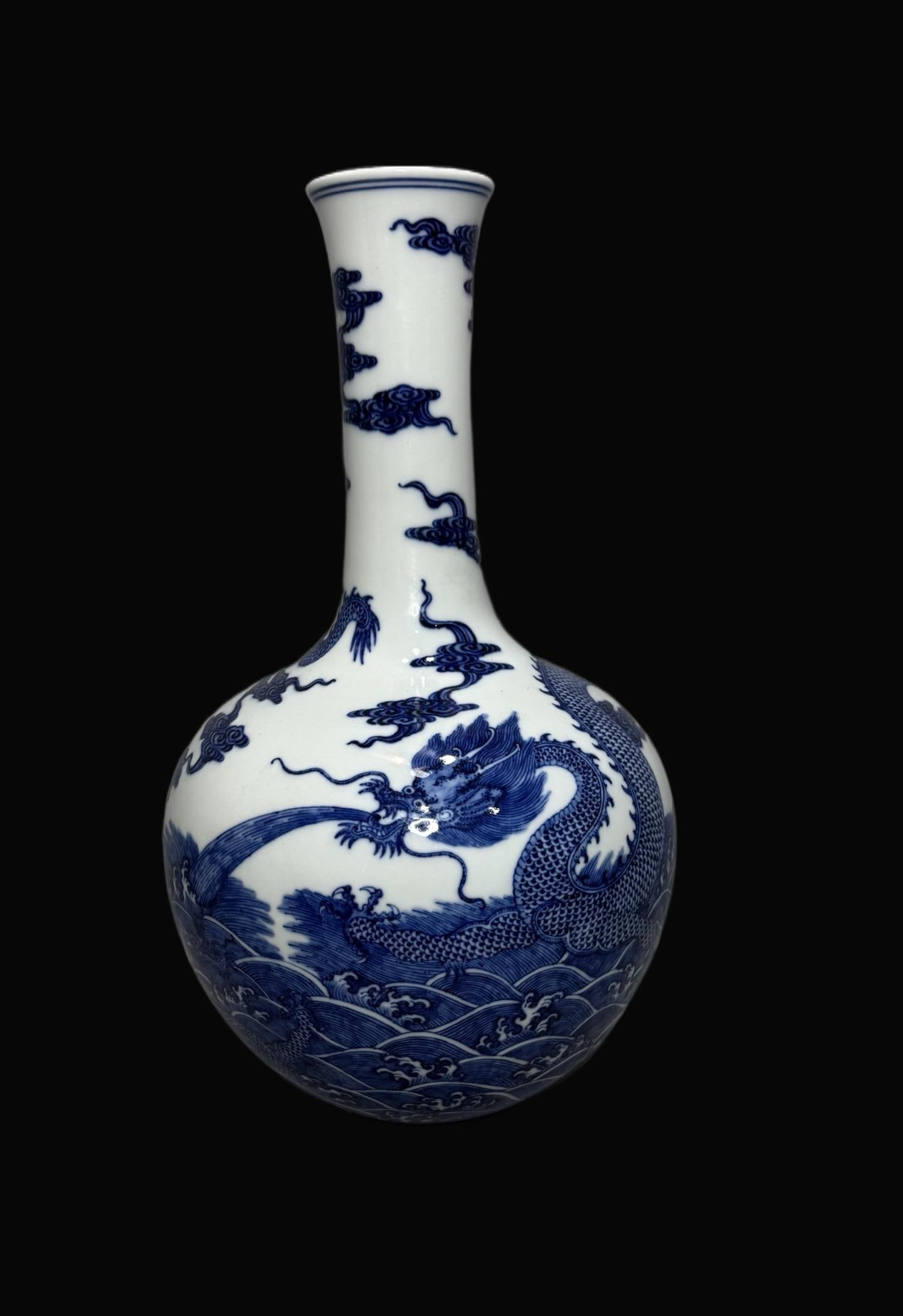 A Exquisite Blue and White Seawater Dragon Pattern Vase: A Exquisite Blue and White Seawater Dragon Pattern Vase,Qing Dynasty, China,Qianlong Six-character Mark,Size:14.2in 青花海水龙纹瓶,中国清