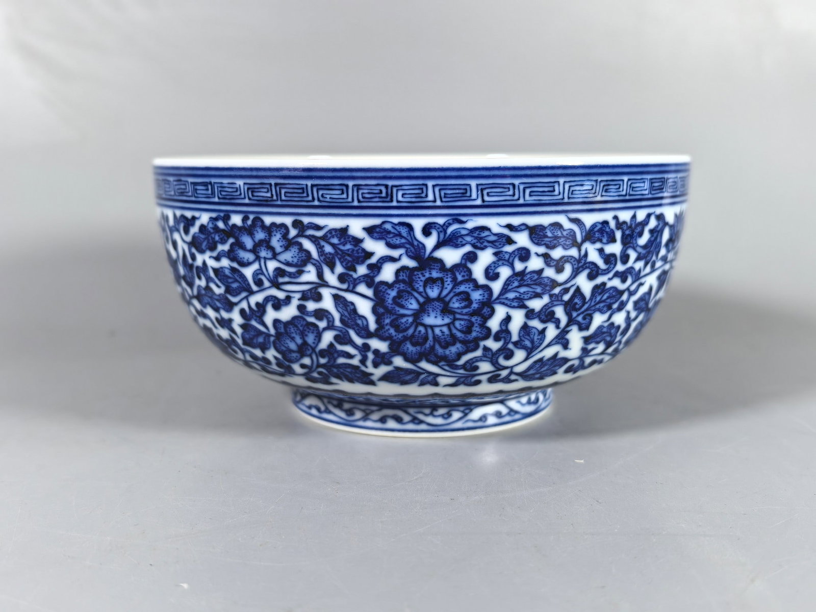 A Exquisite Blue and White Lotus Pattern Bowl: A Exquisite Blue and White Lotus Pattern Bowl,Qing Dynasty, China,Qianlong Six-character Mark,Size:2.9inx5.9inx3.1in 青花缠枝莲纹碗,中国清&#