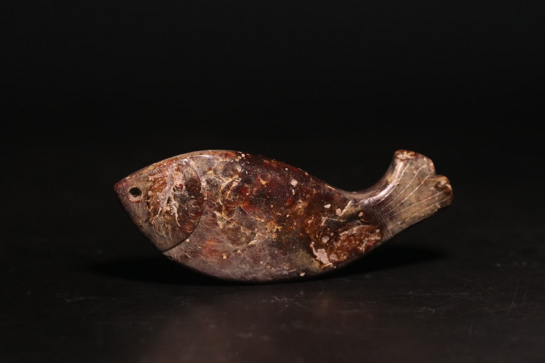 A Exquisite Archaic Jade Fish Handheld Ornament: A Exquisite Archaic Jade Fish Handheld Ornament,Ancient Time, China,Size:3.3inx1.2inx0.4in,Weight:33.6g 高古玉鱼,远古时期